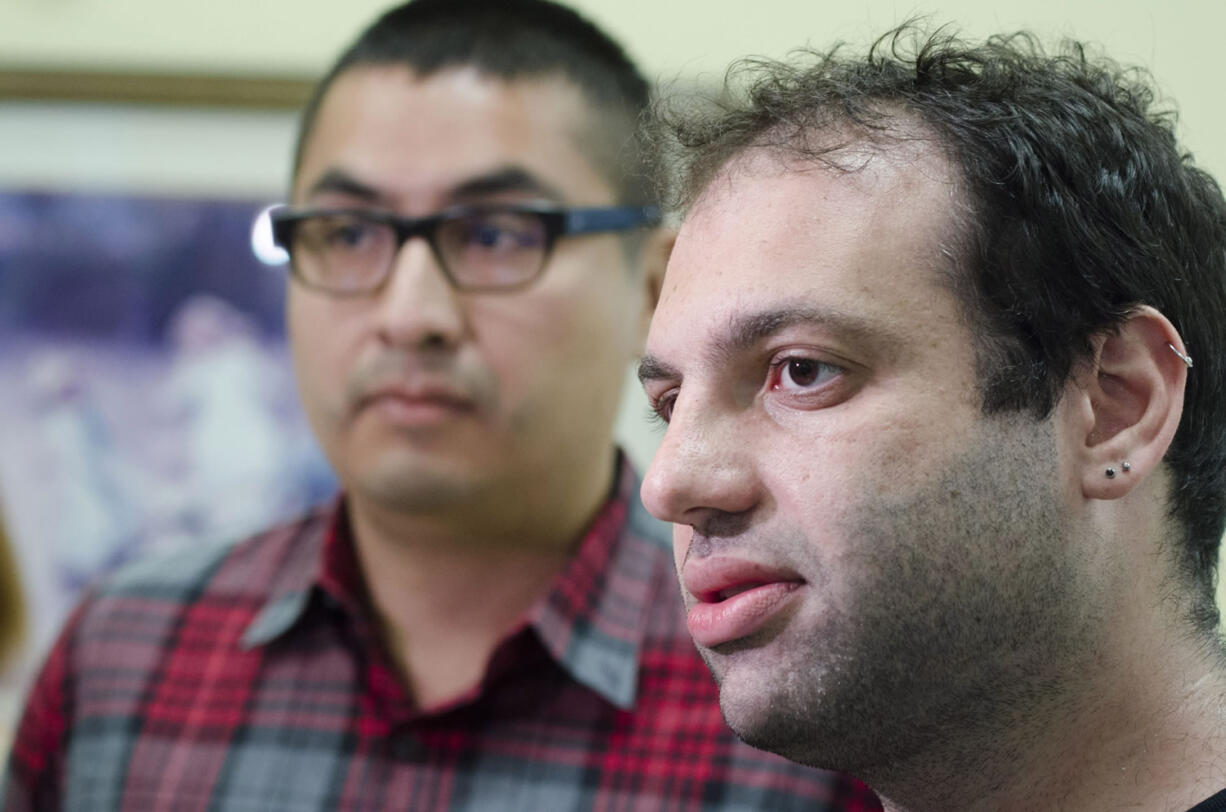 Allen Corona, 34, left, and Mark Shrayber, 32, from San Fransisco, talk to the media after being issued a marriage license in by deputy clerks at the Rowan County Clerk's office Wednesday in Morehead, Ky. Deputy clerk Brian Mason says the office will issues licenses Wednesday in Davis' absence if anyone seeks them. Lawyers for Rowan County clerk Kim Davis say she will return to work Friday or Monday.