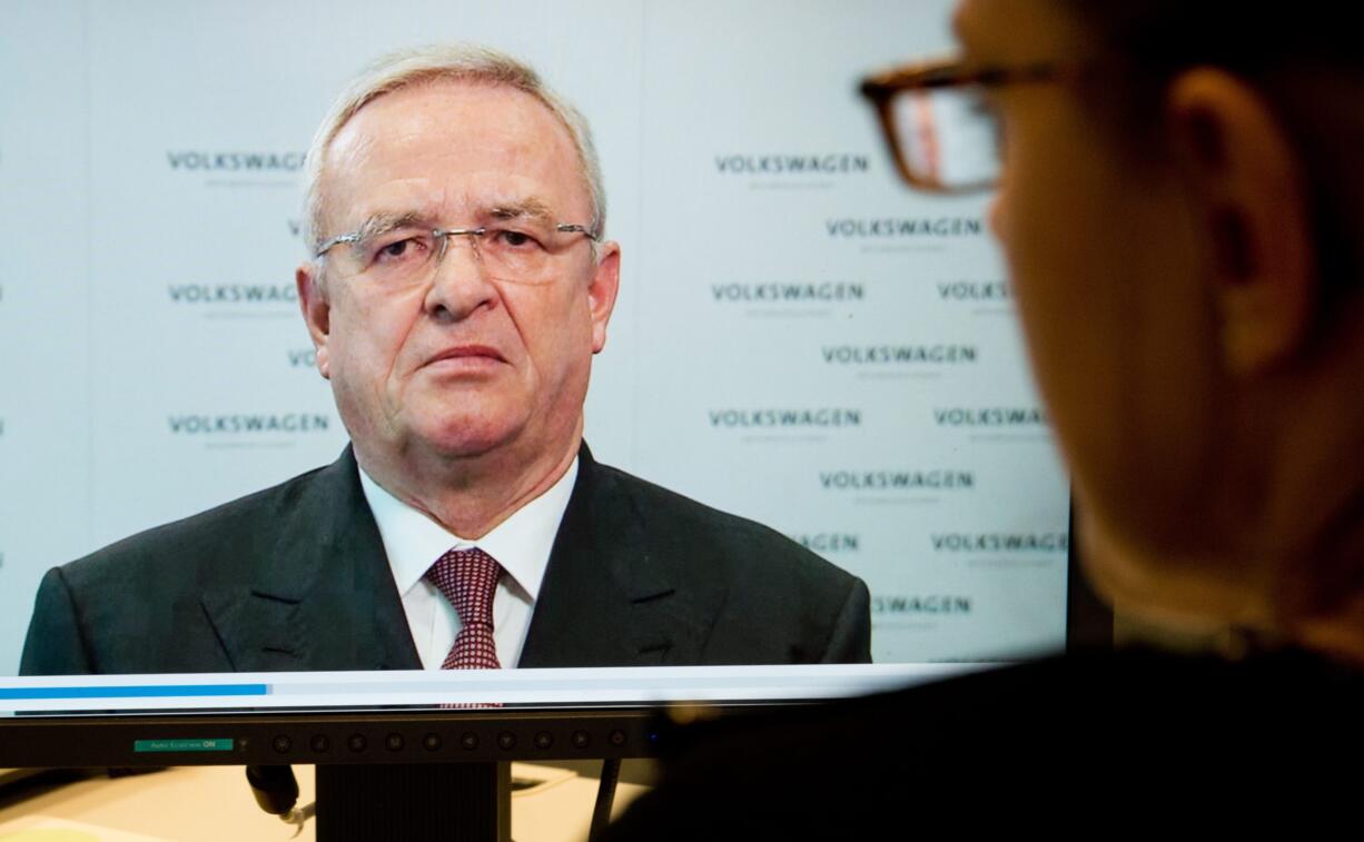 A woman watches a video statement by Volkswagen AG' CEO Martin Winterkorn, on the company's website, in Hanover, Germany,  on Tuesday. Winterkorn  apologized   for the manipulations  of  VW  diesel cars  in the U.S. to defeat  emission tests , and promised a fast and thorough investigation.