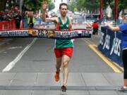 Roseburg, Ore., native Wynston Alberts of Tokyo wins Vancouver USA Marathon in just over 2:30 on Sunday in downtown Vancouver.