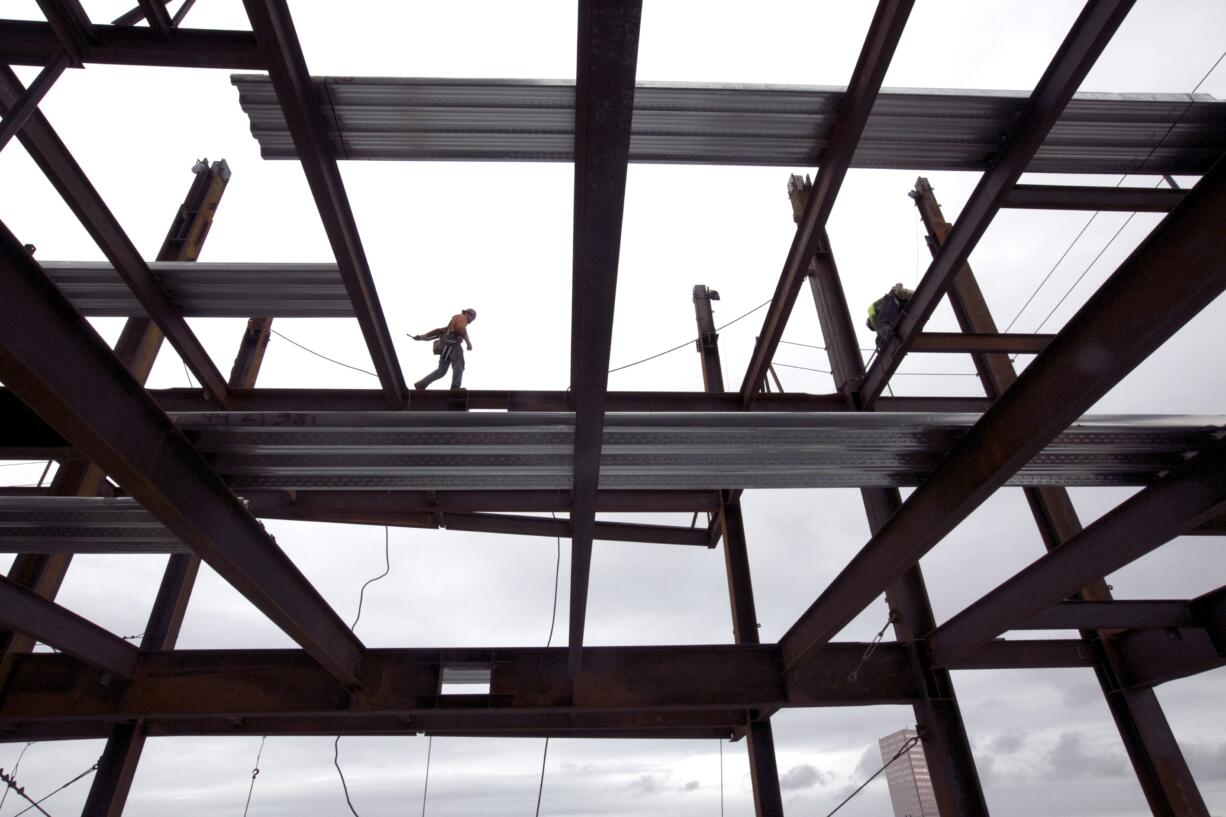 Steelworker Nik Pries of Refa Erection walks across decking 23 stories aboveground Nov. 29 during construction on the new Park Avenue West Tower in downtown Portland. Six years after its financial system nearly sank and nearly that long since the recession ended, the United States seems poised to grow in 2015 at its fastest pace in a decade.