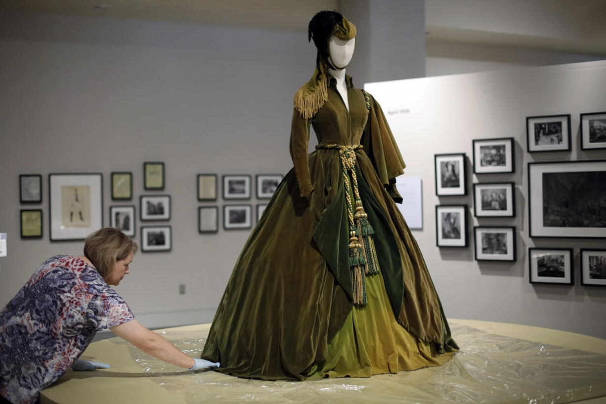 Eric Gay/Associated Press
Conservator Mary Baughman prepares the green curtain dress from the movie &quot;Gone with the Wind&quot; for display at the University of Texas in Austin, Texas.