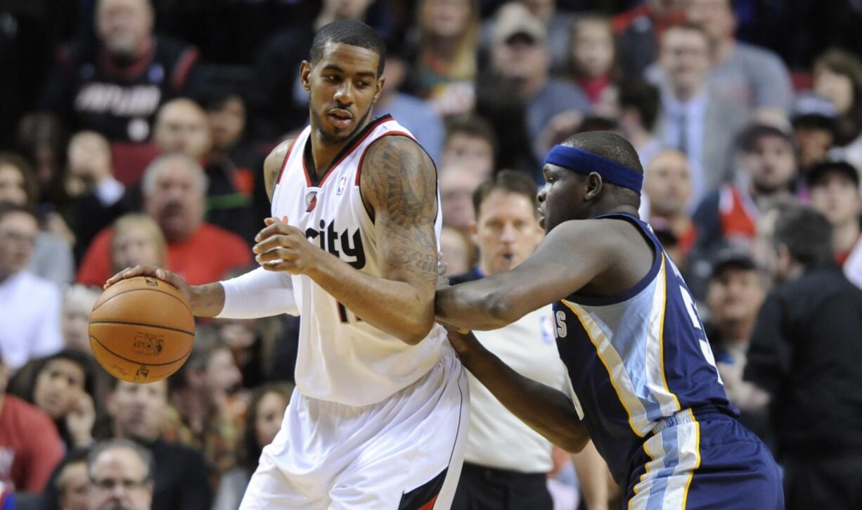 Memphis Grizzlies' Zach Randolph (50) defends against Portland Trail Blazers' LaMarcus Aldridge (12) during the first half Sunday.