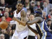 Memphis Grizzlies' Zach Randolph (50) defends against Portland Trail Blazers' LaMarcus Aldridge (12) during the first half Sunday.