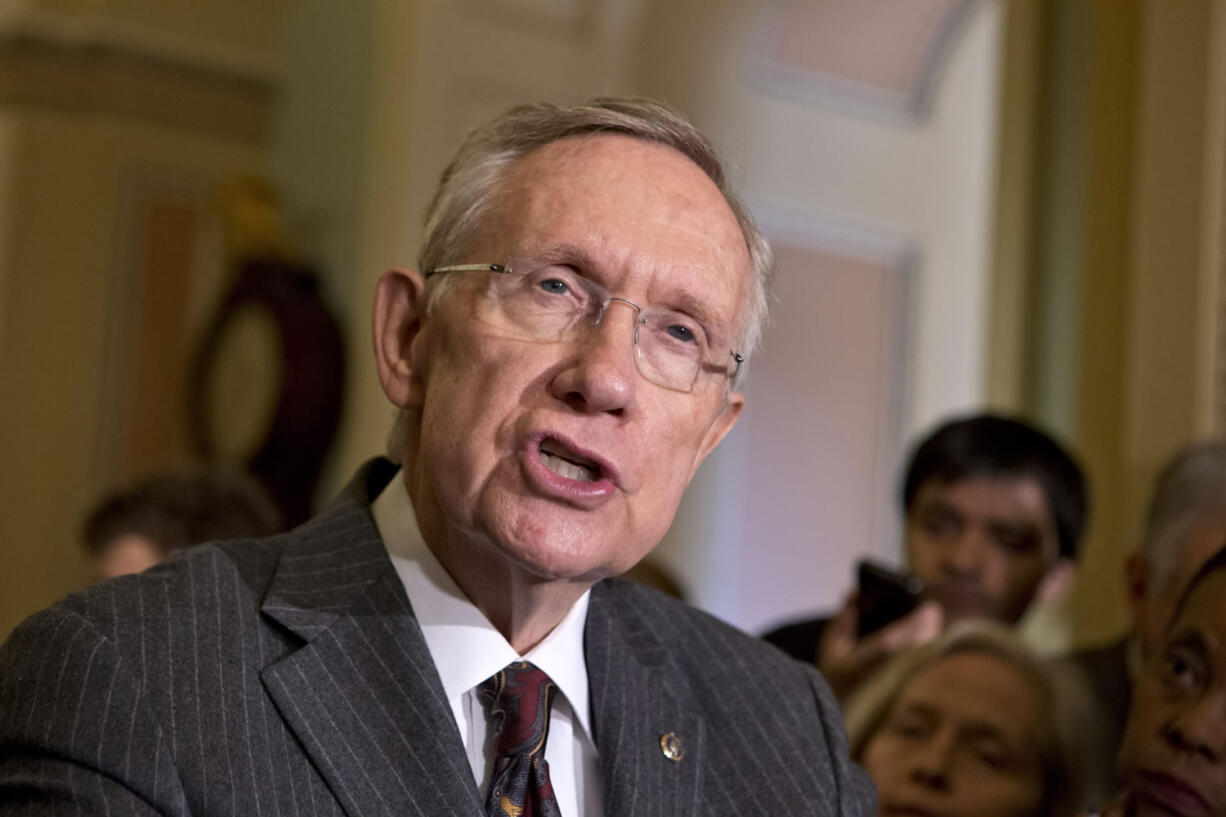 Senate Majority Leader Harry Reid, D-Nev., speaks with reporters about gun control at the Capitol in Washington.