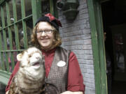 Allie Dillard shows off a ferret puppet that can be purchased at the Magical Menagerie store during a preview of Diagon Alley at the Wizarding World of Harry Potter at Universal Orlando, Thursday, June 19, 2014, in Orlando, Fla.