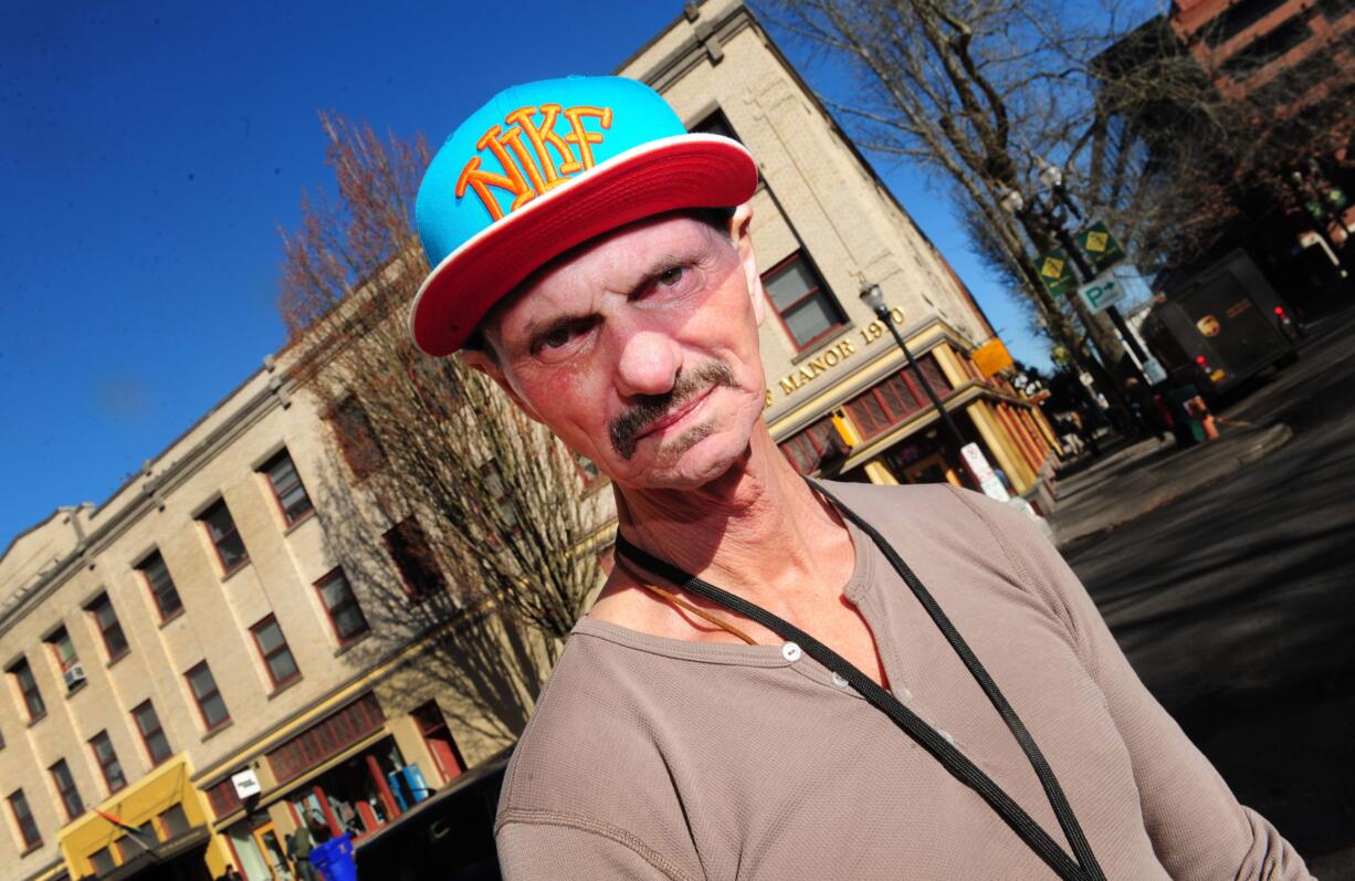 Former heroin addict David Fitzgerald stands near the rehabilitation clinic where he works as the leader of the mentor program in Portland.