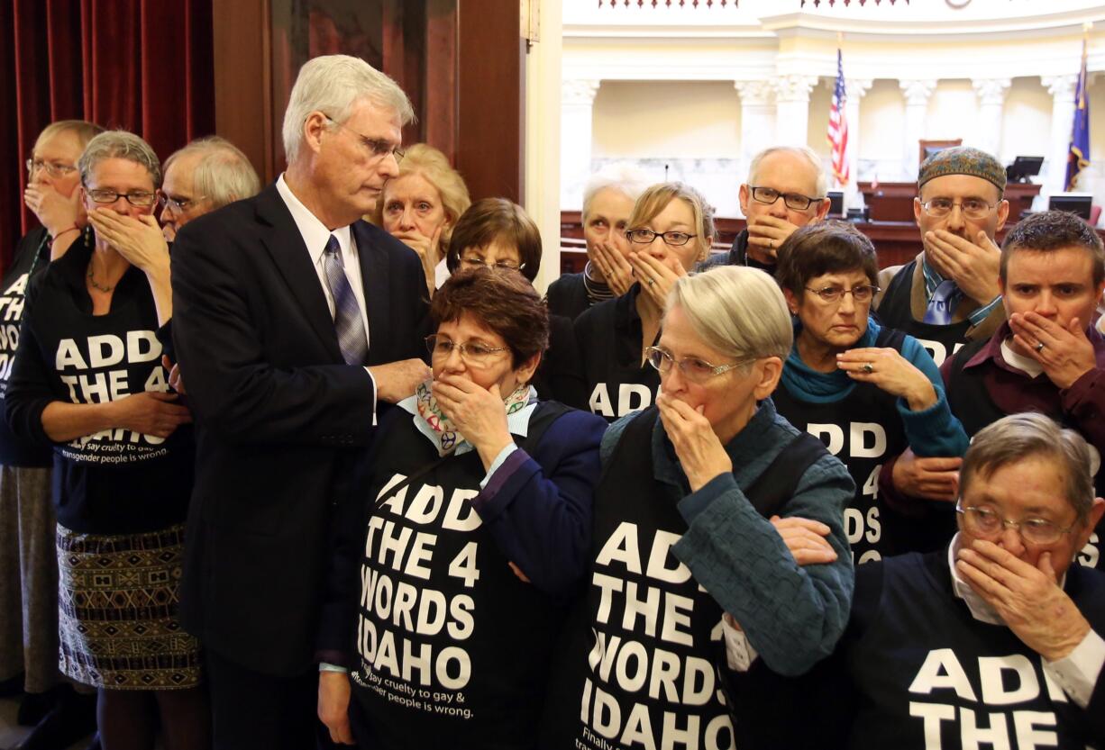 Senate President Pro Tem Brent Hill, R-Rexburg, is blocked by demonstrators from entering the Senate chambers at the Idaho Statehouse on Monday morning.