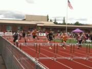 Prairie's Peter Zalk, fifth from left, races to victory in the 110 hurdles at the 3A bi-district track meet Saturday in Sumner.