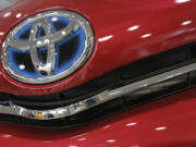 The emblem of a Toyota car shines at Toyota Motor Corp.'s showroom Toyota Mega Web in Tokyo.