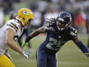 Seattle Seahawks cornerback Richard Sherman (25) begins pass coverage against a Green Bay Packers receiver during a game last season in Seattle.