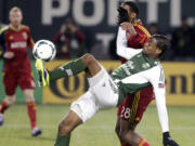 Portland Timbers forward Frederic Piquionne right, battles for the ball in last season's Western Conference finals.