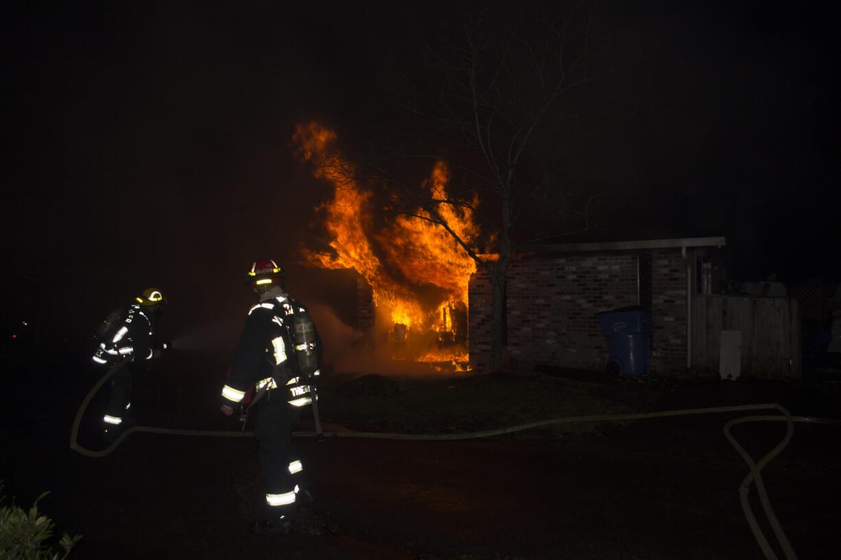 Fire officials said that candles likely ignited a fire at a duplex in Vancouver's Bagley Downs neighborhood early this morning, displacing two residents.