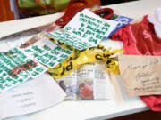 Items Deb Greene, a 65-year-old Ballard grandmother, donated to the Museum of History and Industry in Seattle on July 22 include two grams of the Sweet Lafayette strain of cannabis, upper left, part of Seattle's first legal pot purchase, along with clothes she wore and the book she read as she waited for 21 hours at the front of the line, all of which will go into MOHAI's permanent collection.