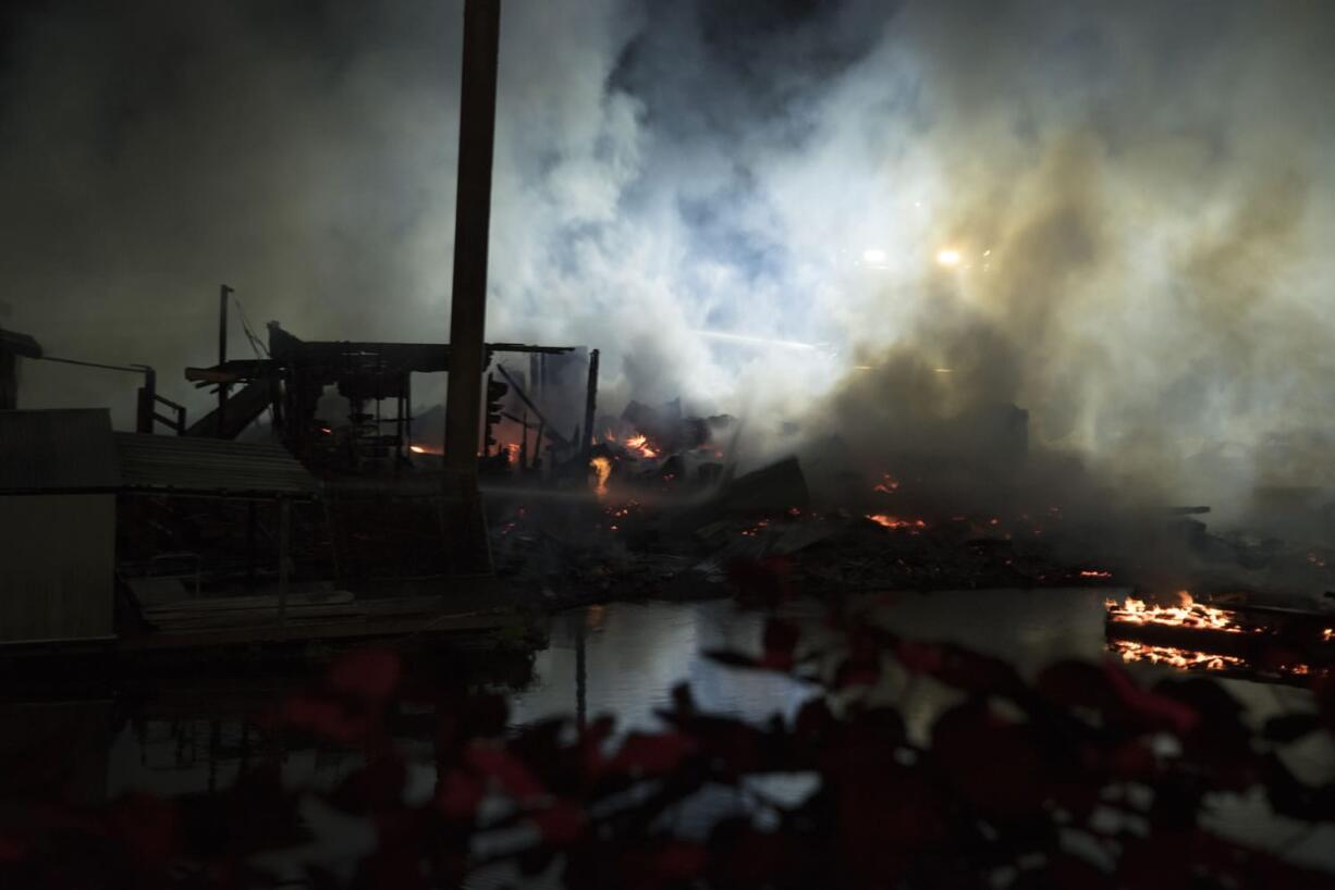 Fire investigators will be at the scene today of a fire that destroyed two floating homes Kadow’s Caterpillar Island Marina off Lower River Road.