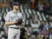 Seattle Mariners relief pitcher Charlie Furbush looks off to the outfield after loading the bases against the Houston Astros in the 11th inning Friday. The Astros won 5-4.