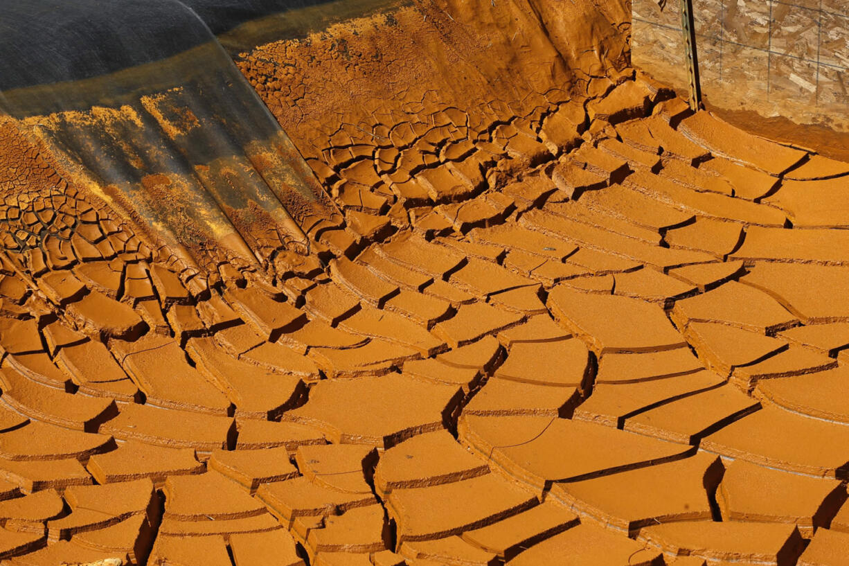 FIA dried-out mine wastewater sediment pond in the San Juan Mountains north of Silverton, Colo., on Aug. 14. The focus on the toxic mine spill that fouled rivers in three states shifts to Congress the week of Sept. 7 as lawmakers kick off a series of hearings into how the U.S. Environmental Protection Agency accidentally unleashed the deluge of poisoned water.