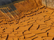 FIA dried-out mine wastewater sediment pond in the San Juan Mountains north of Silverton, Colo., on Aug. 14. The focus on the toxic mine spill that fouled rivers in three states shifts to Congress the week of Sept. 7 as lawmakers kick off a series of hearings into how the U.S. Environmental Protection Agency accidentally unleashed the deluge of poisoned water.