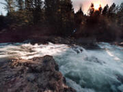 Columbian files
Lucia Falls on the East Fork of the Lewis River churns around its narrow bend of lava rock as the sun shines through tall conifers, dappling the deep shadows with brilliant highlights.