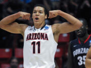 Arizona forward Aaron Gordon reacts after scoring a basket while playing Gonzaga during the first half of a third-round game in the NCAA college basketball tournament, Sunday, March 23, 2014, in San Diego.