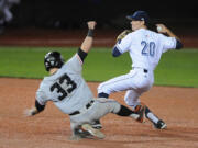 UC Irvine's John Brontsema turns a double play over Oregon State's Logan Ice to win the NCAA college baseball regional tournament in Corvallis, Ore., Monday, June 2, 2014.