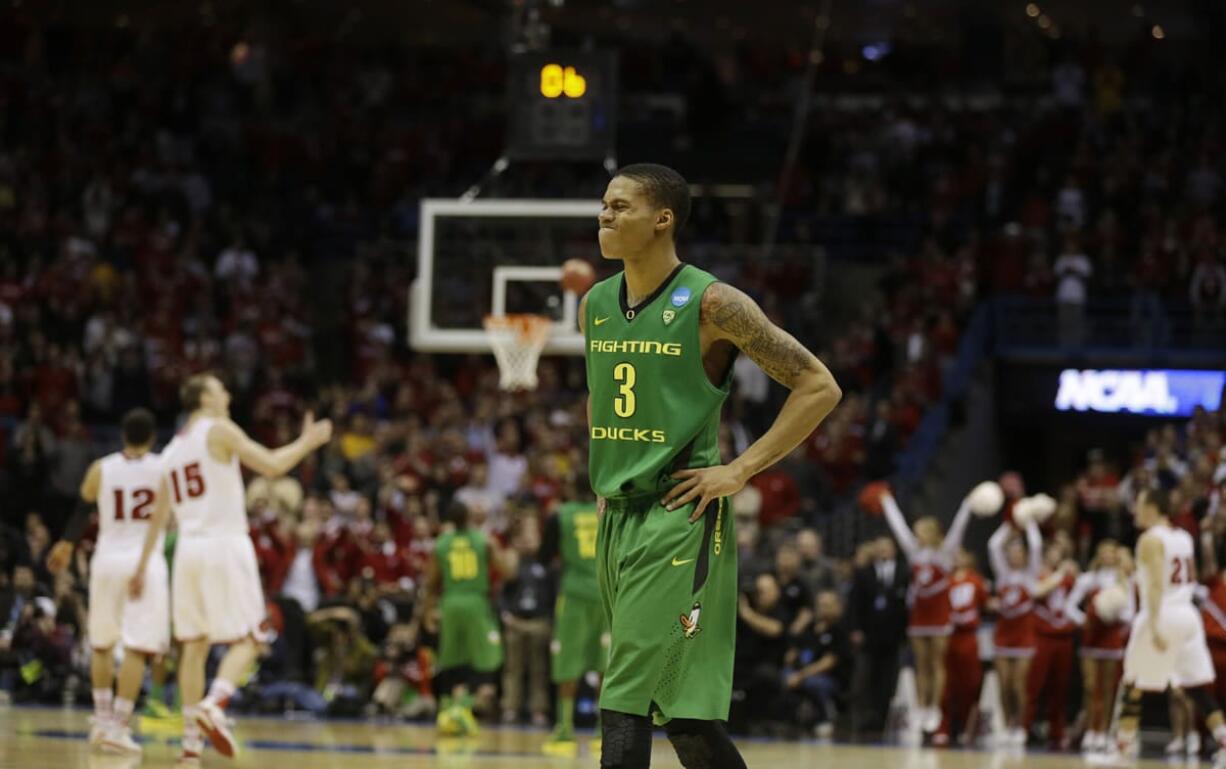 Oregon guard Joseph Young (3) reacts during the second half of a third-round game against the Wisconsin in the NCAA college basketball tournament Saturday, March 22, 2014, in Milwaukee. Wisconsin won 82-77.