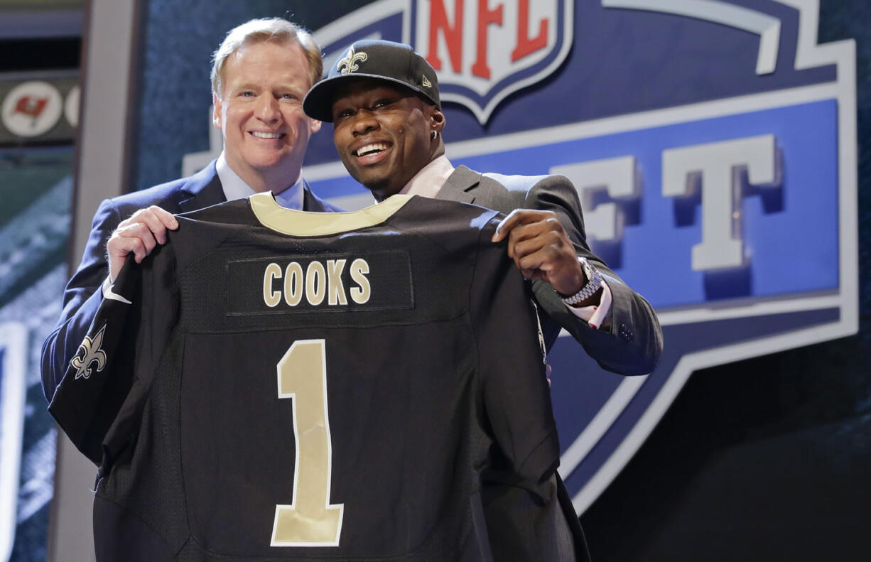 Oregon State wide receiver Brandon Cooks poses with NFL commissioner Roger Goodell after being selected by the New Orleans Saints as the 20th pick the first round of the 2014 NFL Draft, Thursday.