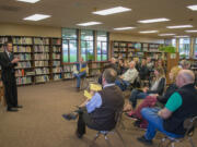 Nathan McCann, left, speaks with the local community during a forum in the Ridgefield High School library before getting the job.