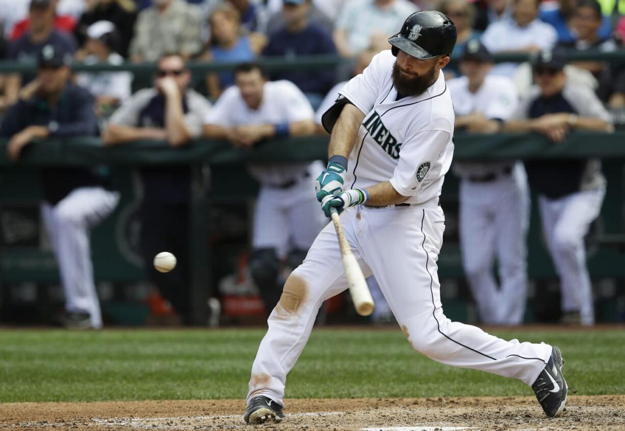 Seattle Mariners' Dustin Ackley hits a three-run home run in the fifth inning against the Washington Nationals, Sunday, Aug. 31, 2014, in Seattle. (AP Photo/Ted S.