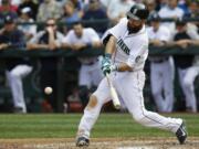 Seattle Mariners' Dustin Ackley hits a three-run home run in the fifth inning against the Washington Nationals, Sunday, Aug. 31, 2014, in Seattle. (AP Photo/Ted S.