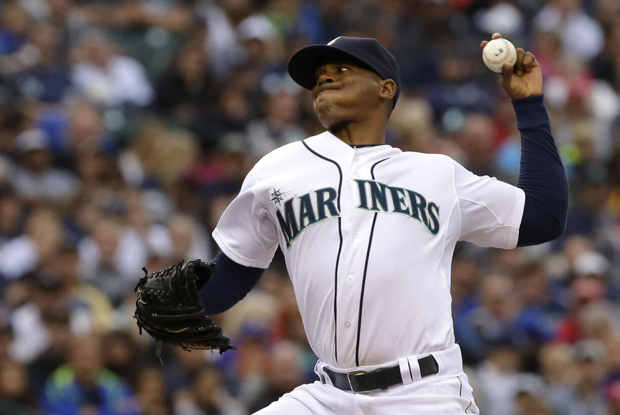 Seattle Mariners starting pitcher Roenis Elias kicks throws against the Washington Nationals during the fourth inning of a baseball game, Saturday, Aug. 30, 2014, in Seattle. (AP Photo/Ted S.