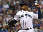 Seattle Mariners starting pitcher Roenis Elias kicks throws against the Washington Nationals during the fourth inning of a baseball game, Saturday, Aug. 30, 2014, in Seattle. (AP Photo/Ted S.