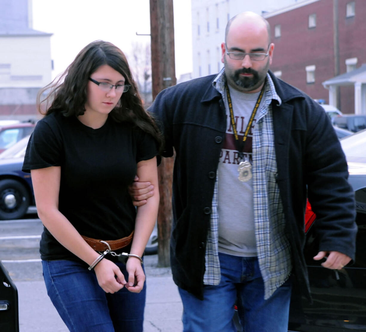 Miranda K. Barbour is led into District Judge Ben Apfelbaum's office in Sunbury, Pa., by Sunbury policeman Travis Bremigen on Dec. 3.