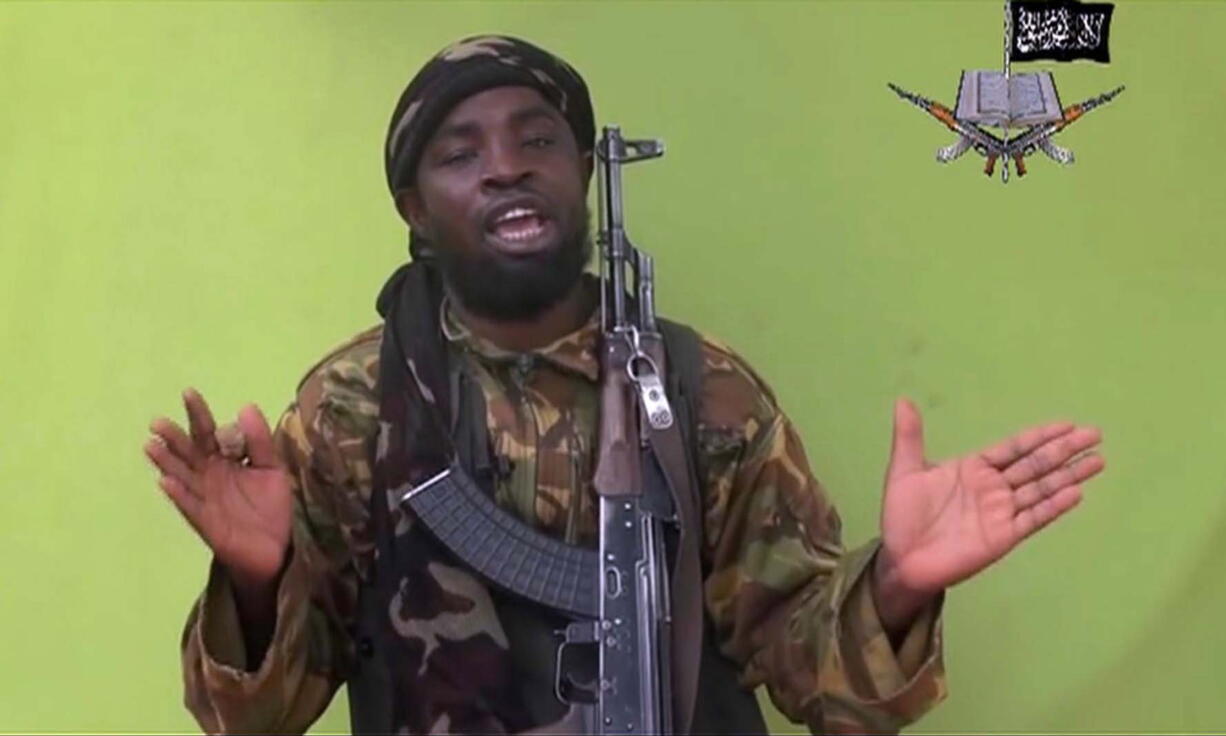 Nigeria's Boko Haram leader Abubakar Shekau speaks to the camera in a new video purports to show dozens of abducted schoolgirls, covered in jihab and praying in Arabic.