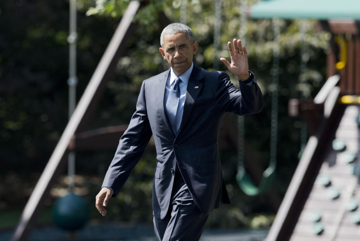 President Barack Obama, waves as he leaves the White House in Washington on Wednesday. Obama is teaming up with Dr. Jill Biden, the wife of the vice president and a community college teacher, to visit Macomb County Community College in Warren, Michigan, on Wednesday. They planned to announce an independent College Promise Advisory Board, led by Biden, that will highlight existing programs providing free community college.