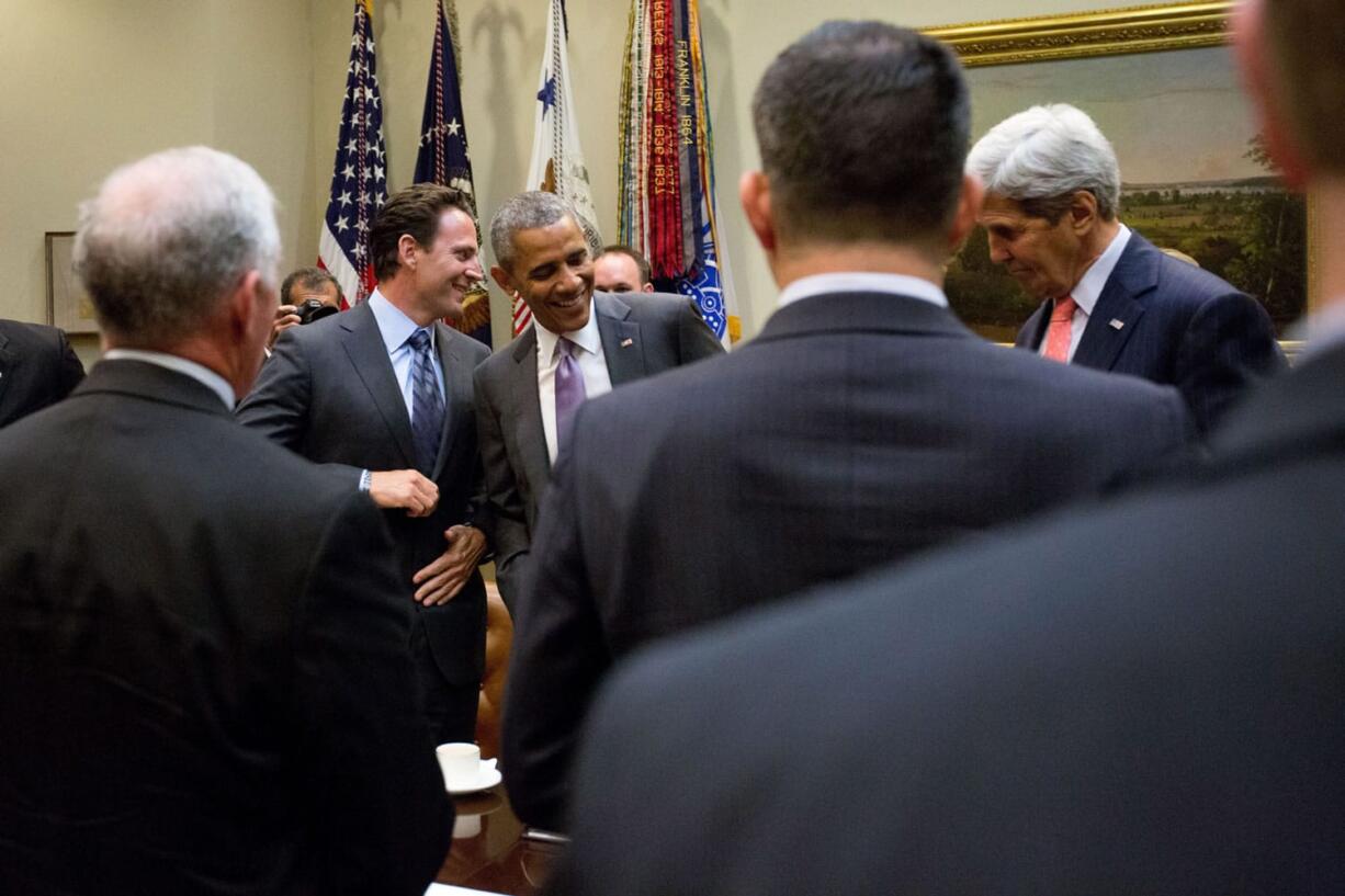 President Barack Obama speaks with Nathan Fletcher, of the Truman National Security Project in the Roosevelt Room of the White House in Washington on Thursday  following a meeting with veterans and Gold Star Mothers to discuss the Iran Nuclear deal. Secretary of State John Kerry is at right.