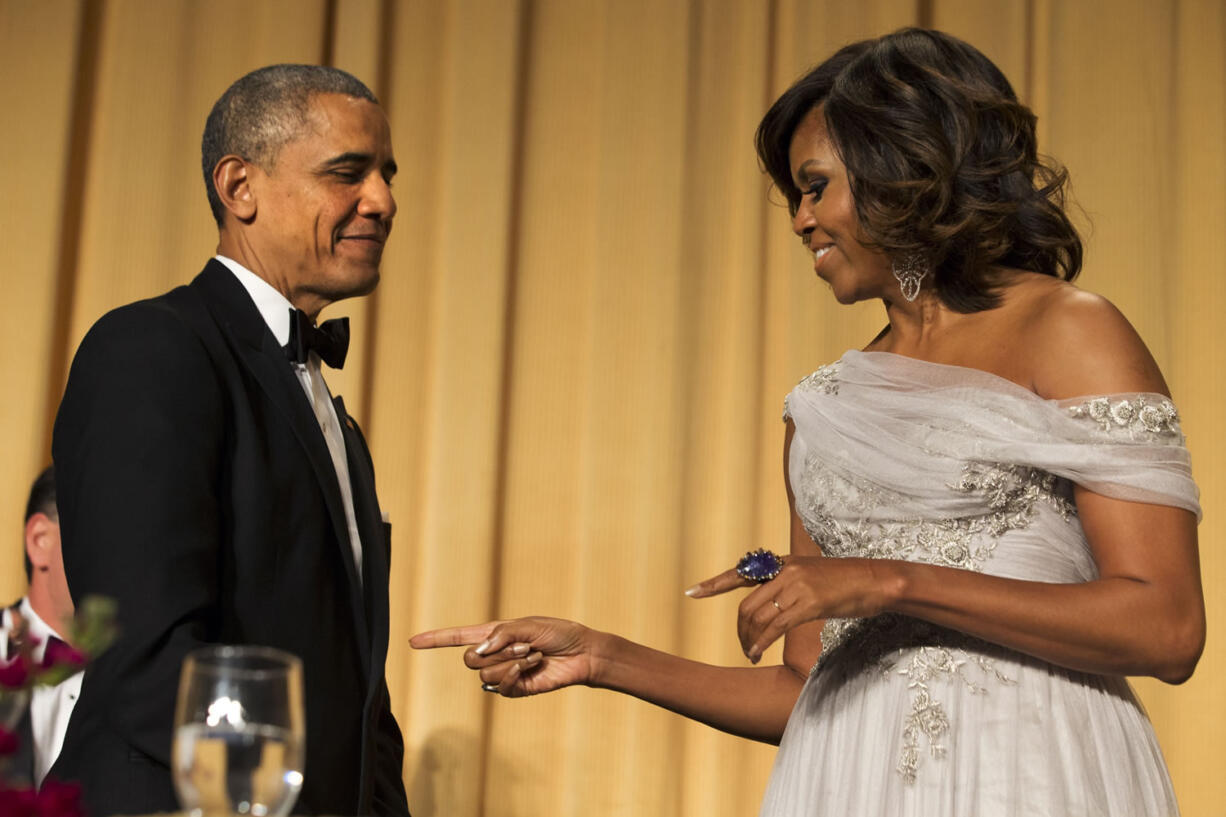 First lady Michelle Obama jokes with President Barack Obama on Saturday at the White House Correspondents' Association Dinner in Washington.