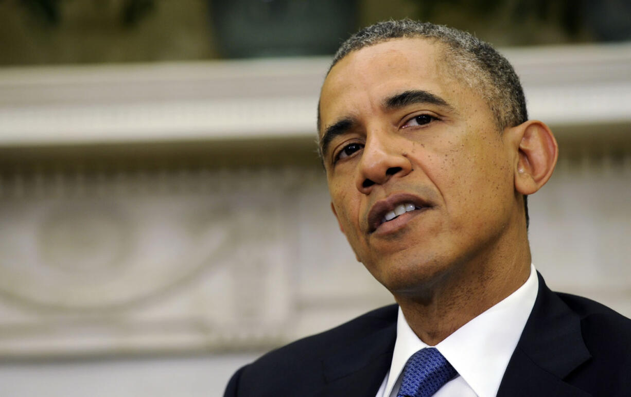 President Barack Obama speaking during a press availability with Uruguay's President Jose Mujica in the Oval Office of the White House in Washington.