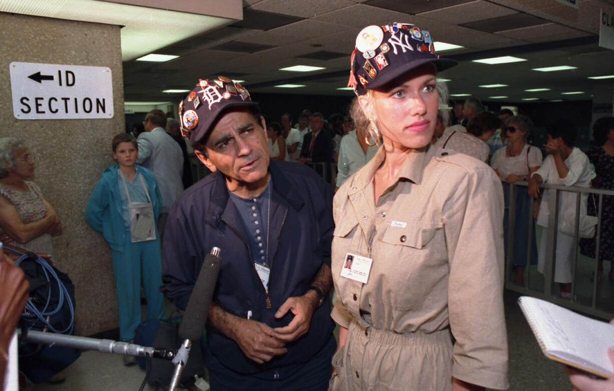 Casey Kasem and his wife, Jean, meet with reporters July 8, 1987, at Dulles International Airport in Chantilly, Va., upon the arrival of their group from the Soviet Union. Kasem, the smooth-voiced radio broadcaster who became the king of the top-40 countdown, died today, according to Danny Deraney, publicist for Kasem's daughter, Kerri.