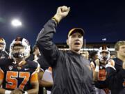 FILE - In this Friday, Sept. 4, 2015 file photo, Oregon State football coach Gary Anderson celebrates a  26-7 win over Weber State after an NCAA college football game in Corvallis, Ore.  With a young team, a true freshman quarterback, and a new scheme on both offense and defense, the first-year Oregon State coach had figured there would be growing pains.