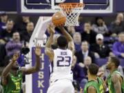 Washington guard C.J. Wilcox shoots against Oregon in the second half Thursday. Wilcox led all scorers with 23 points and Washington won 80-76.