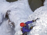 A climber making her way up the Ouray Ice Park in Ouray, Colo.