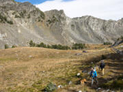 Hikers walk through the Tobacco Root Mountains near Pony, Mont. For all their splendor, the Tobacco Roots don't attract the large numbers of outdoors people who head to the Gallatin, Absaroka and Madison ranges each summer.