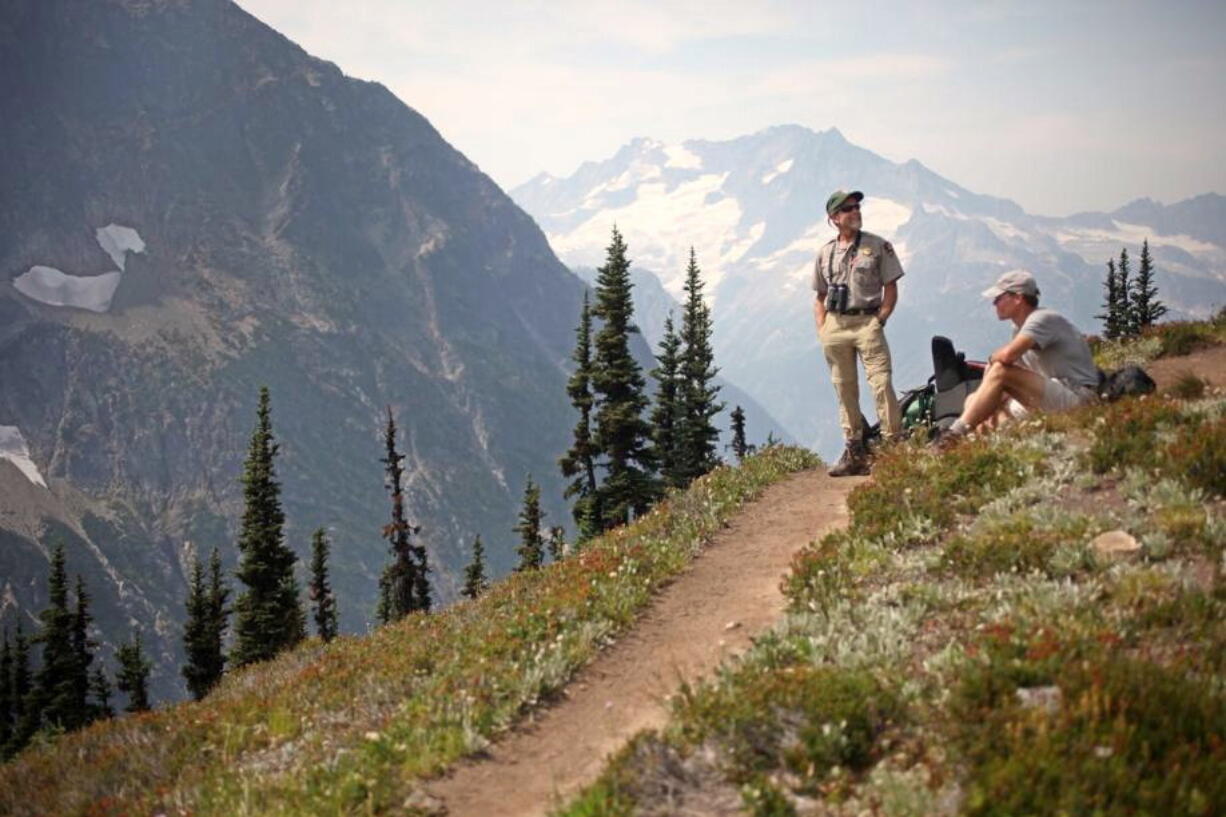 Hikers rest on Easy Pass in Washington's North Cascades near Marblemount.