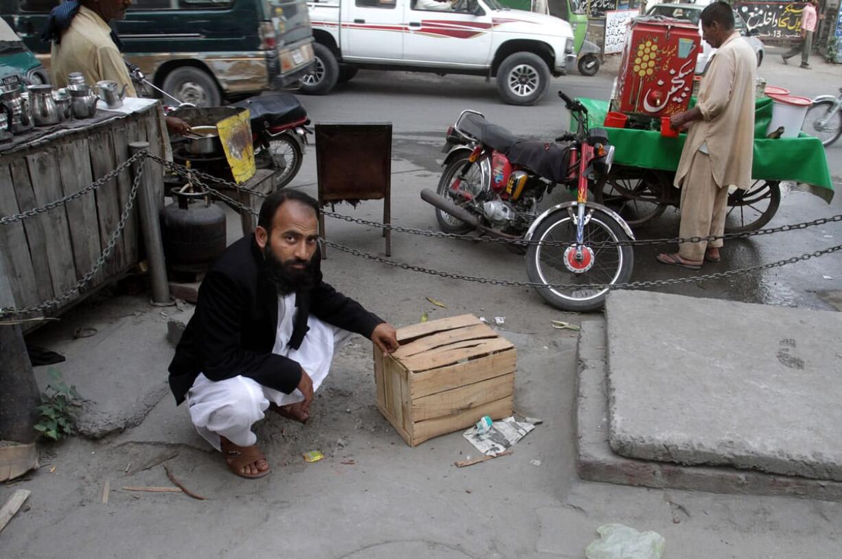 Mustafa Kharal, lawyer for Farzana Parveen, who was stoned to death by family members, shows the area where she was killed Wednesday in Lahore, Pakistan.