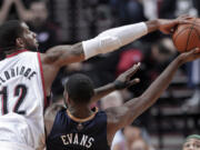 Portland Trail Blazers forward LaMarcus Aldridge, left, blocks a shot by New Orleans Pelicans guard Tyreke Evans during the second half in Portland, Ore., Sunday.