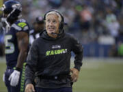 Seattle Seahawks head coach Pete Carroll smiles on the sidelines during in the first half of a preseason NFL football game against the Oakland Raiders, Thursday, Sept. 3, 2015, in Seattle.