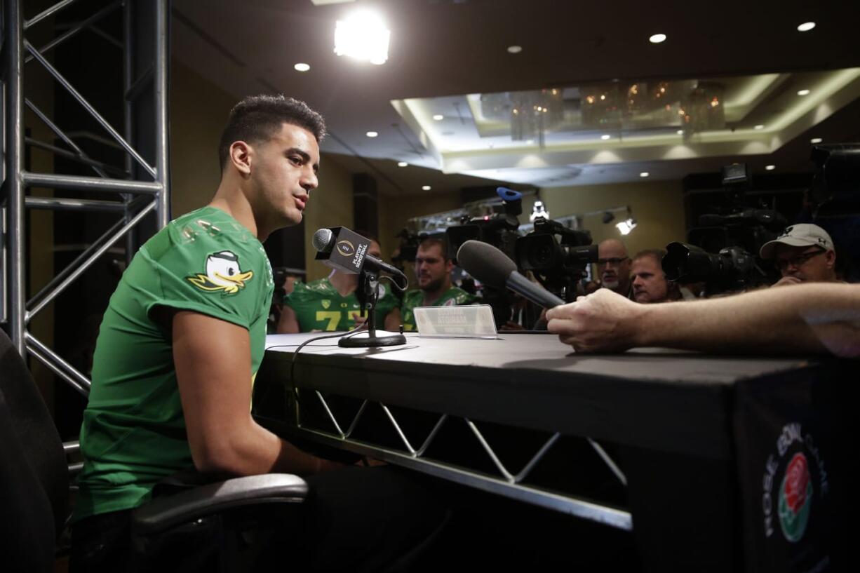 Oregon quarterback Marcus Mariota talks to reporters during the team's media day Monday, Dec. 29, 2014, in Los Angeles. Oregon is scheduled to play Florida State in the Rose Bowl NCAA college football playoff semifinal on New Year's Day. (AP Photo/Jae C.