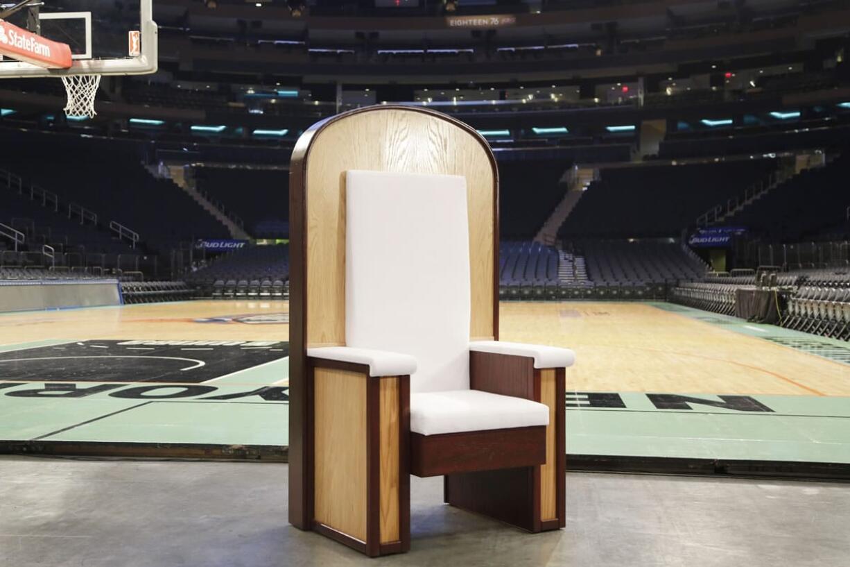 The Pope's chair is unveiled during a media event at New York's Madison Square Garden, Wednesday, Sept. 2, 2015. The simple wooden chair has been built for Pope Francis when he celebrates Mass at the sports and entertainment arena on Friday, Sept. 25.