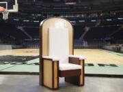 The Pope's chair is unveiled during a media event at New York's Madison Square Garden, Wednesday, Sept. 2, 2015. The simple wooden chair has been built for Pope Francis when he celebrates Mass at the sports and entertainment arena on Friday, Sept. 25.