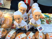 Pope Francis dolls nestled among baked goods are offered for sale at a 7-Eleven store in the Times Square area of New York on Thursday. Souvenirs are popping up all over the city to mark the pope's visit to New York on Sept 24 and 25.